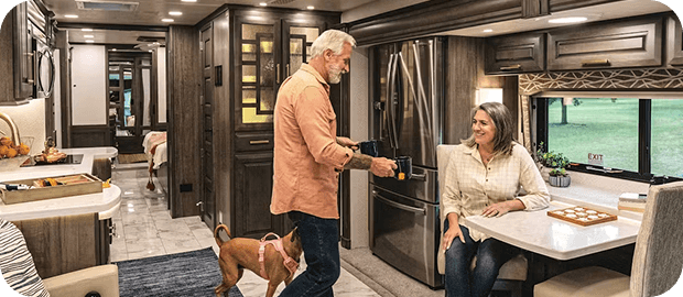 Person being served a plate of food in their RV