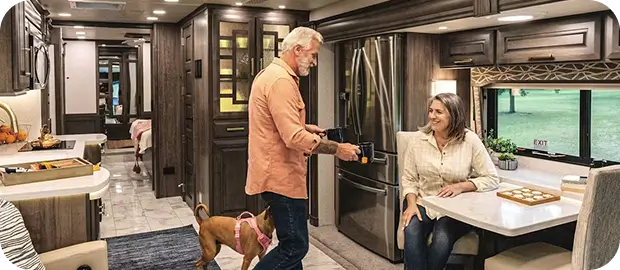 Person being served a plate of food in their RV